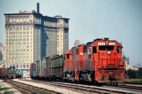 Westbound Detroit, Toledo and Ironton Railroad freight train on Conrail at the Michigan Central Station in Detroit, Michigan, on June 3, 1976. Photograph by John F. Bjorklund, © 2016, Center for Railroad Photography and Art. Bjorklund-50-23-06