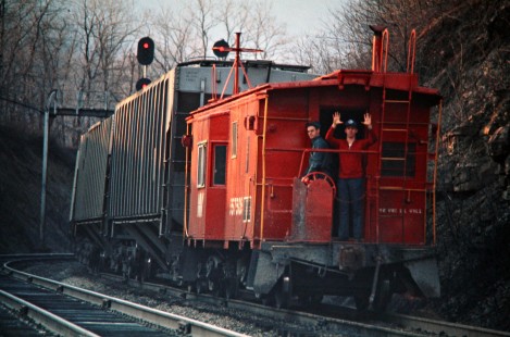 Crewmembers on the caboose of an eastbound Western Maryland Railway freight train in Mount Savage, Maryland, on March 22, 1975. Photograph by John F. Bjorklund, © 2016, Center for Railroad Photography and Art. Bjorklund-92-04-15