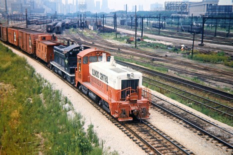 Illinois Central Railroad switchers no. 1240 and 1216 with a transfer freight train on the St. Charles Air Line from 18th Street in Chicago, Illinois, on July 5, 1971. Photograph by John F. Bjorklund, © 2016, Center for Railroad Photography and Art. Bjorklund-60-02-08