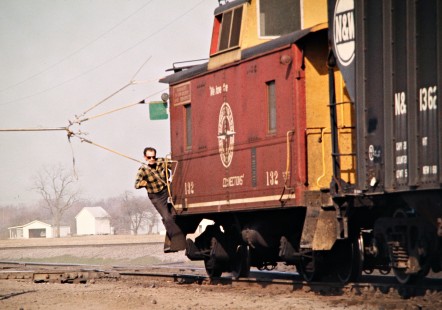 Southbound Detroit, Toledo and Ironton Railroad crewman grabbing orders at Ann Tower in Dundee, Michigan, on April 8, 1973. Photograph by John F. Bjorklund, © 2016, Center for Railroad Photography and Art. Bjorklund-50-06-13