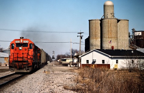 Southbound Detroit, Toledo and Ironton Railroad freight train  in Maybee, Michigan, on April 1, 1984. Photograph by John F. Bjorklund, © 2016, Center for Railroad Photography and Art. Bjorklund-52-18-12
