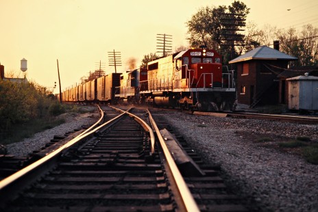Eastbound Grand Trunk Western Railroad freight train in Holly, Michigan, on April 30, 1977. Photograph by John F. Bjorklund, © 2016, Center for Railroad Photography and Art. Bjorklund-58-20-05