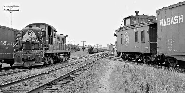 Southbound Cotton Belt Route local freight train pulls into yard at Fordyce, Arkansas, as the Alco RSD locomotive for a northbound passes in June 1960. Photograph by J. Parker Lamb, © 2016, Center for Railroad Photography and Art. Lamb-02-058-03