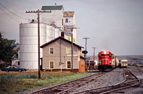 Westbound Soo Line Railroad freight train at Kenmare, North Dakota, on July 5, 1980. Photograph by John F. Bjorklund, © 2016, Center for Railroad Photography and Art. Bjorklund-83-06-07