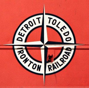 Detroit, Toledo and Ironton Railroad logo at Flat Rock, Michigan, on November 16, 1974. Photograph by John F. Bjorklund, © 2016, Center for Railroad Photography and Art. Bjorklund-50-16-04
