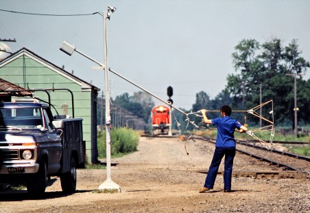 Operator preparing orders for a southbound Detroit, Toledo and Ironton Railroad freight train at Diann Tower in Dundee, Michigan, on June 21, 1981. Photograph by John F. Bjorklund, © 2016, Center for Railroad Photography and Art. Bjorklund-52-02-03