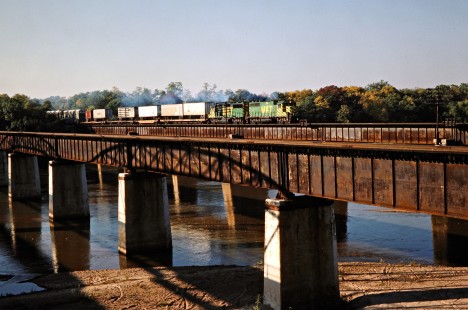 Westbound Missouri–Kansas–Texas Railroad freight train across the Arkansas River in Muskogee, Oklahoma, on October 16, 1988. Photograph by John F. Bjorklund, © 2016, Center for Railroad Photography and Art. Bjorklund-70-19-11