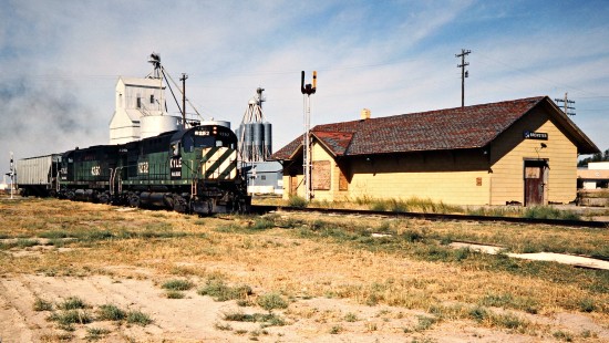 Eastbound Kyle Railroad freight train at Brewster, Kansas, (on the former Rock Island) on October 1, 1983. Photograph by John F. Bjorklund, © 2016, Center for Railroad Photography and Art. Bjorklund-82-15-08