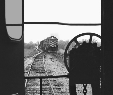 Northbound Missouri–Kansas–Texas Railroad manifest freight train approaches south switch of yard in Granger, Texas, in December 1981 (view from caboose of local). Photograph by J. Parker Lamb, © 2016, Center for Railroad Photography and Art. Lamb-02-046-12