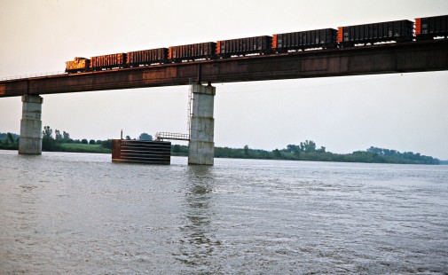 Caboose of a southbound Kansas City Southern Railway coal train crossing the Arkansas River in Spiro, Oklahoma, on July 18, 1977. Photograph by John F. Bjorklund, © 2016, Center for Railroad Photography and Art. Bjorklund-61-15-03