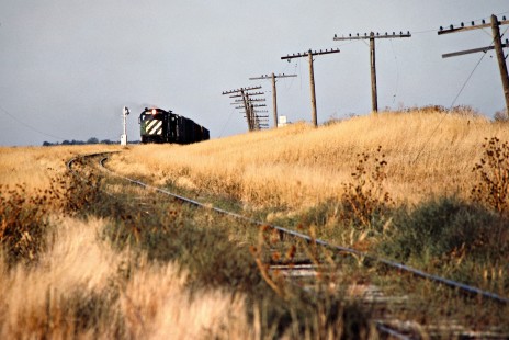 Eastbound Kyle Railroad freight train near Edson, Kansas, (on the former Rock Island) on October 1, 1983. Photograph by John F. Bjorklund, © 2016, Center for Railroad Photography and Art. Bjorklund-82-14-15