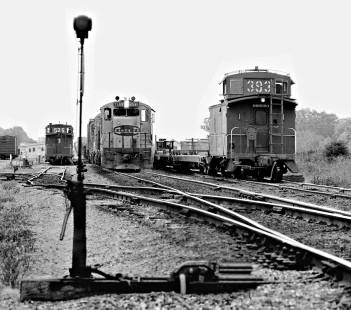 Northbound Atchison, Topeka and Santa Fe Railway freight train passes inbound train at north end of yard at Belleville, Texas, in August 1975. Photograph by J. Parker Lamb, © 2016, Center for Railroad Photography and Art. Lamb-02-067-09