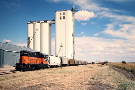 Eastbound Cadillac and Lake City Railway freight train at Arriba, Colorado, (on the former Rock Island) on September 30, 1983. Photograph by John F. Bjorklund, © 2016, Center for Railroad Photography and Art. Bjorklund-82-12-08