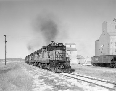 Milwaukee Road diesel locomotive no. 556 leads eastbound freight near Square Butte, Montana, on February 24, 1980. Photograph by Victor Hand. Hand-MILW-67-170