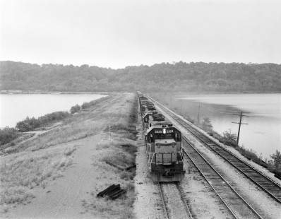 Milwaukee Road diesel locomotive no. 2024 hauls eastbound freight near Sabula, Iowa, on October 6, 1973. Photograph by Victor Hand; Hand-MILW-67-031