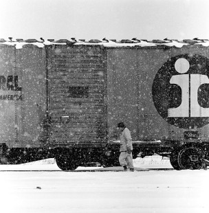 An Erie Lackawanna trainman trudges through a Buffalo, New York lake effect snowfall at EL's Bison Yard in the early 1970s.

Read more about the <a href="http://www.railphoto-art.org/awards/2019-awards/" rel="noreferrer nofollow">2019 John E. Gruber Creative Photography Awards Program</a>.