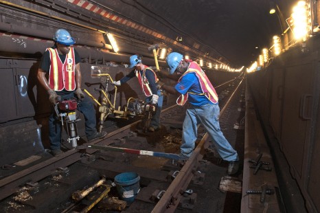 MTA New York City Transit track workers repairing section of track just north of 57th Station, on July 23, 2011. 

Read more about the <a href="http://www.railphoto-art.org/awards/2019-awards/" rel="noreferrer nofollow">2019 John E. Gruber Creative Photography Awards Program</a>.