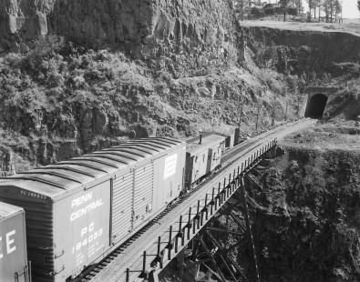 Caboose of eastbound Milwaukee Road freight train at Tunnel 44 on the edge of Rock Lake in Washington on June 18, 1978. Photograph by Victor Hand. Hand-MILW-67-088