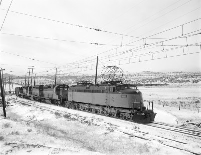 Milwaukee Road electric locomotive no. E20 hauls eastbound freight near Vendome, Montana, on December 5, 1972. Photograph by Victor Hand; Hand-MILW-67-016