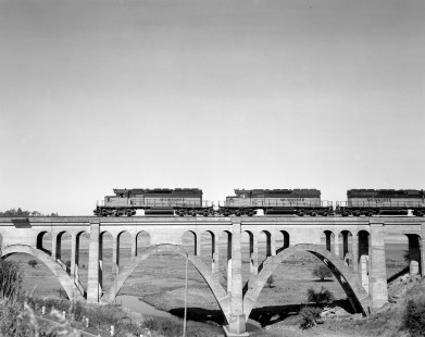 Milwaukee Road diesel locomotive no. 18 leads westbound freight train no. 201 across the Rosalia Railroad Bridge near Rosalia, Washington on September 13, 1979. Photograph by Victor Hand. Hand-MILW-67-151