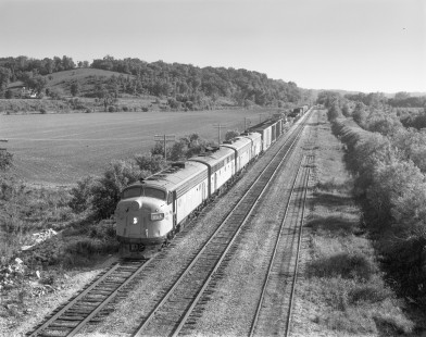 Milwaukee Road diesel locomotive no. 86A leads eastbound freight train no. 106 between Cedar Rapids and Savanna at Green Island, Iowa on May 28, 1979. Photograph by Victor Hand. Hand-MILW-67-125