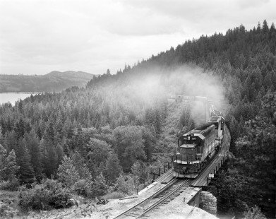 Milwaukee Road diesel locomotive no. 168 leads westbound freight train no. 205 near Peede, Idaho on June 16, 1978. Photograph by Victor Hand. Hand-MILW-67-069