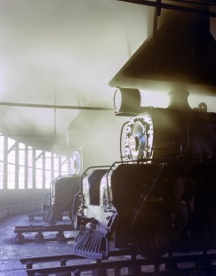 New Zealand Government Railways steam locomotives no. 1209 and no. 1237 in roundhouse in Greymouth, New Zealand, on June 9, 1967. Photograph by Victor Hand. NZGR-C12-69