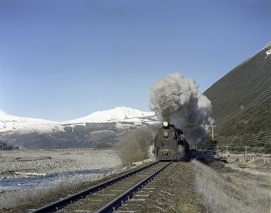 New Zealand Government Railways steam locomotive no. 1242 leads westbound freight near Arthur's Pass on the South Island of New Zealand on July 21, 1966. Photograph by Victor Hand.Hand-NZGR-C10-28.JPG
