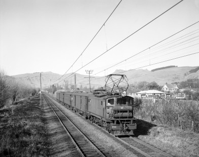 New Zealand Government Railways electric locomotive no. E08, leads a passenger train near Christchurch, New Zealand on July 26, 1966. Photograph by Victor Hand; Hand-NZGR-10-895.JPG.