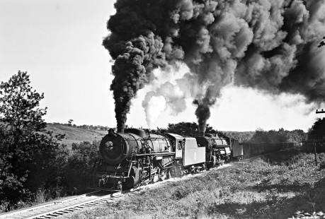 Lehigh and New England steam locomotives double-heading to pull a forty-four-car freight train west at Orange Farm, New York, on April 28, 1946. 301, a 2-8-0 of the E-14 class, leads a 2-10-0 of the F-1 class. Photograph by Donald W. Furler, Furler-02-037-02, © 2017, Center for Railroad Photography and Art