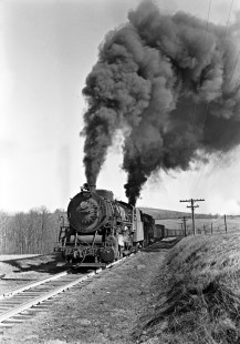 Lehigh and New England steam locomotives double-heading to pull twenty-five cars of a freight train east up the steep grade to Summit, Pennsylvania, on March 31, 1946. Leading the charge is 306, a 2-8-0 of the E-14 class, followed by 2-10-0 F-1 403. Photograph by Donald W. Furler, Furler-02-049-01, © 2017, Center for Railroad Photography and Art