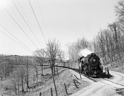 Lehigh and Hudson River Railway 2-8-0 locomotive no. 90 pulls a fifty-six car freight train east at a rural road crossing in Craigville, New York, on April 28, 1940. Photograph by Donald W. Furler, Furler-03-064-01, © 2017, Center for Railroad Photography and Art