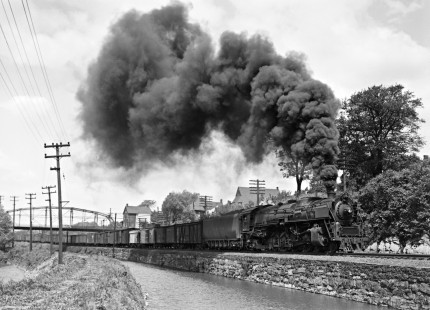 Lehigh and Hudson River Railway 4-8-2 steam locomotive  no. 12 leads a freight train west along the Lehigh Coal and Navigation Company canal near Bethlehem, Pennsylvania, on May 31, 1947. The train is utilizing trackage rights over the Central Railroad of New Jersey to acess Allentown Yard. Photograph by Donald W. Furler, Furler-22-004-01, © 2017, Center for Railroad Photography and Art