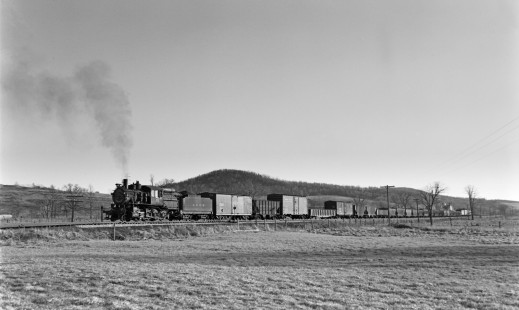 Lehigh and Hudson River 2-8-0 camelback steam locomotive 63 leads a freight train on April 10, 1949. Photograph by Donald W. Furler, Furler-22-012-01, © 2017, Center for Railroad Photography and Art