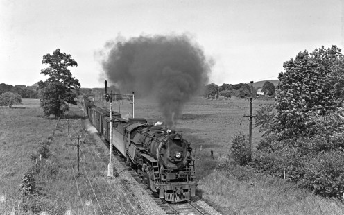 Lehigh and Huson River Railway 2-8-0 steam locomotive no. 94 leads a freight train past semaphore signals in 1950. Image shot in Wisner, New York from old Wisner overpass. Photograph by Donald W. Furler, Furler-22-036-02, © 2017, Center for Railroad Photography and Art