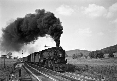 Lehigh and Hudson River Railway 2-8-2 steam locomotive no. 83 steams west with a freight train through Sugar Loaf, New York, following directly behind another freight west pulled by locomotive 11, June 1945. Photograph by Donald W. Furler, Furler-01-057-01, © 2017, Center for Railroad Photography and Art