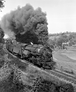 Lehigh and Hudson River Railway 2-8-0 steam locomotive no. 91 pulls a freight train west through Craigville, New York, in 1945. Photograph by Donald W. Furler, Furler-01-075-01, © 2017, Center for Railroad Photography and Art