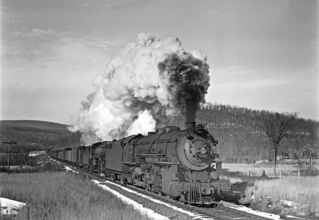 Delaware, Lackwanna, and Western Railroad steam locomotive no. 2110 leads Lehigh and Hudson River Railway steam locomotive no. 81 on forty-nine car Maybrook-Port Morris freight train west at Waterloo, New Jersey, on December 4, 1940. Photograph by Donald W. Furler, Furler-03-059-02, © 2017, Center for Railroad Photography and Art