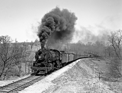 Lehigh and Hudson River 2-8-2 locomotive 83 pulls a thirty-eight-car freight train west through Craigville, New York, on April 28, 1940. Photograph by Donald W. Furler, Furler-03-062-02, © 2017, Center for Railroad Photography and Art