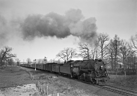 Lehigh and Hudson River 2-8-0 steam locomotive no. 91 leads a freight train through semaphore signals, departing Warwick yard on April 18, 1948. Pelton road cross is visible in the background. Photograph by Donald W. Furler, Furler-22-026-02, © 2017, Center for Railroad Photography and Art