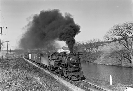 Lehigh and Hudson River Railway 2-8-0 locomotive no. 94 leads a freight train along Kimbal's Pond in Monroe, New Jersey, on April 2, 1950. Photograph by Donald W. Furler, Furler-22-035-02, © 2017, Center for Railroad Photography and Art