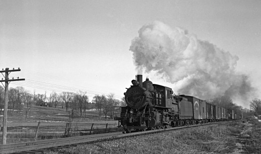 Lehigh and Hudson River Railway 2-8-0 camelback steam locomotive leads an eighteen-car local freight train east near Hamptonburgh, New York, on March 3, 1946. Photograph by Donald W. Furler, Furler-24-125-02, © 2017, Center for Railroad Photography and Art