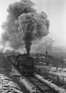 Lehigh and Hudson River Railway 2-8-2 steam locomotive no. 73 pulling a Warwick-Port Morris freight train with eighteen cars at Andover, New Jersey, on January 26, 1946. Photograph by Donald W. Furler, Furler-01-030-01, © 2017, Center for Railroad Photography and Art