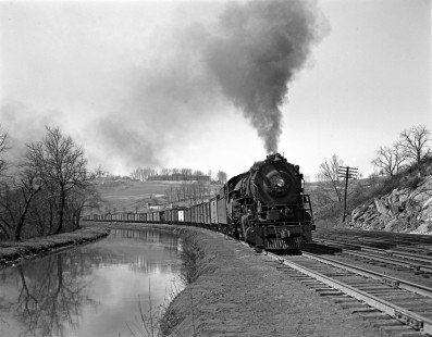 Lehigh and Hudson River Railway 2-8-0 locomotive 94 leads a freight train east at Bethlehem, Pennsylvania, exercising trackage rights over the Central Railroad of New Jersey to Easton in 1940. The Allentown State Hospital stands on the distant ridge. Photograph by Donald W. Furler, Furler-03-066-04, © 2017, Center for Railroad Photography and Art