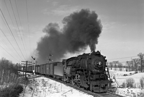 Lehigh and Hudson River 2-8-0 steam locomotive no. 94 steams west through Lake, New York, with a freight train circa 1945. Photograph by Donald W. Furler, Furler-22-038-02, © 2017, Center for Railroad Photography and Art
