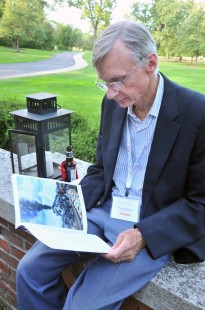 Richard McQuade, who traveled from Canada, looks at the conference program during the reception on Saturday. CRP&A Conversations 2019 photograph by Henry A. Koshollek