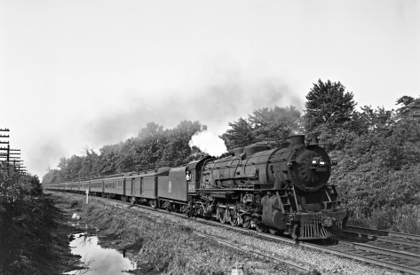 New York, Ontario and Western 4-8-2 steam locomotive 408 leading a passenger train at an unrecorded location on July 13, 1947. Photograph by Donald W. Furler, Furler-22-066-02, © 2017, Center for Railroad Photography and Art