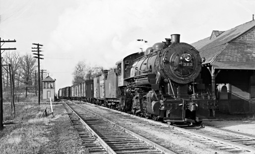 New York, Ontario and Western Railway 2-8-0 steam locomotive 323 leading a freight train west through Campbell Hall, New York, on November 19, 1939. Photograph by Donald W. Furler, Furler-07-130-02. © 2017, Center for Railroad Photography and Art
