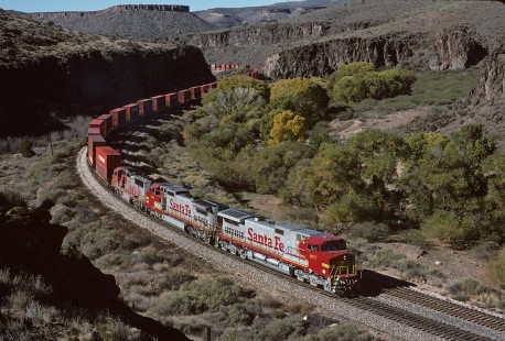 Atchison, Topeka and Santa Fe Railway diesel locomotive no. 677 hauls freight in Crozier Canyon in Arizona on November 6, 1994. Photograph by William Botkin. © 1994, William Botkin