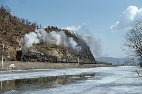 Chinese National Railway QJ-class steam locomotive no. 6794 leads westbound freight train in Dailing, Heilongjiang, China, on April 9, 1988. Photograph by Kate Botkin. BOTKINK-103-KT-56,  © 1988, Kate Botkin